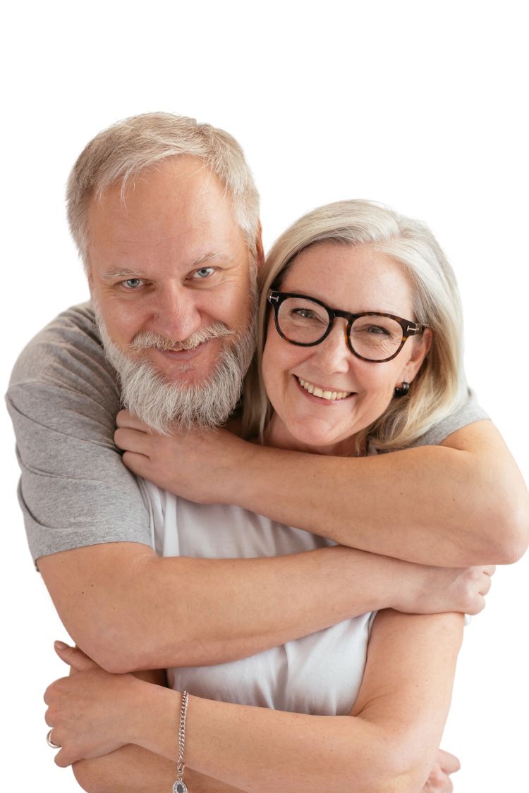 Senior couple in Knoxville sharing a warm embrace, comforted by the security of their burial insurance plan.