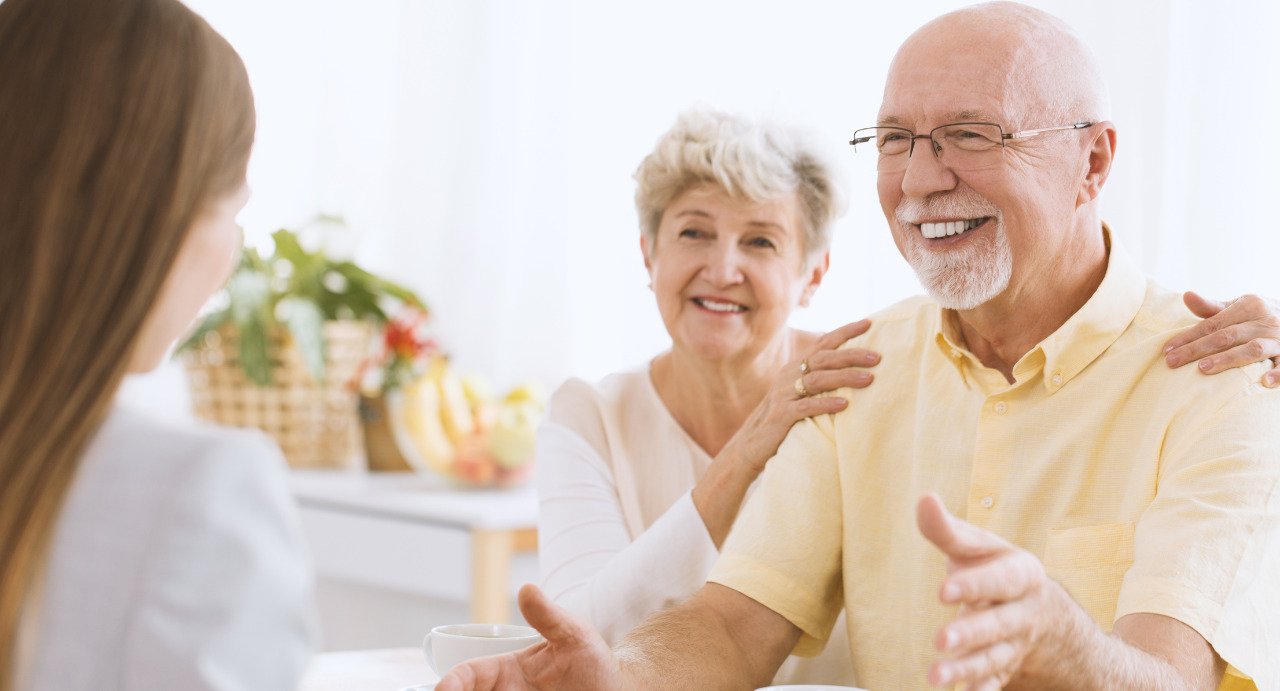 Insurance agent helping seniors with insurance plan.